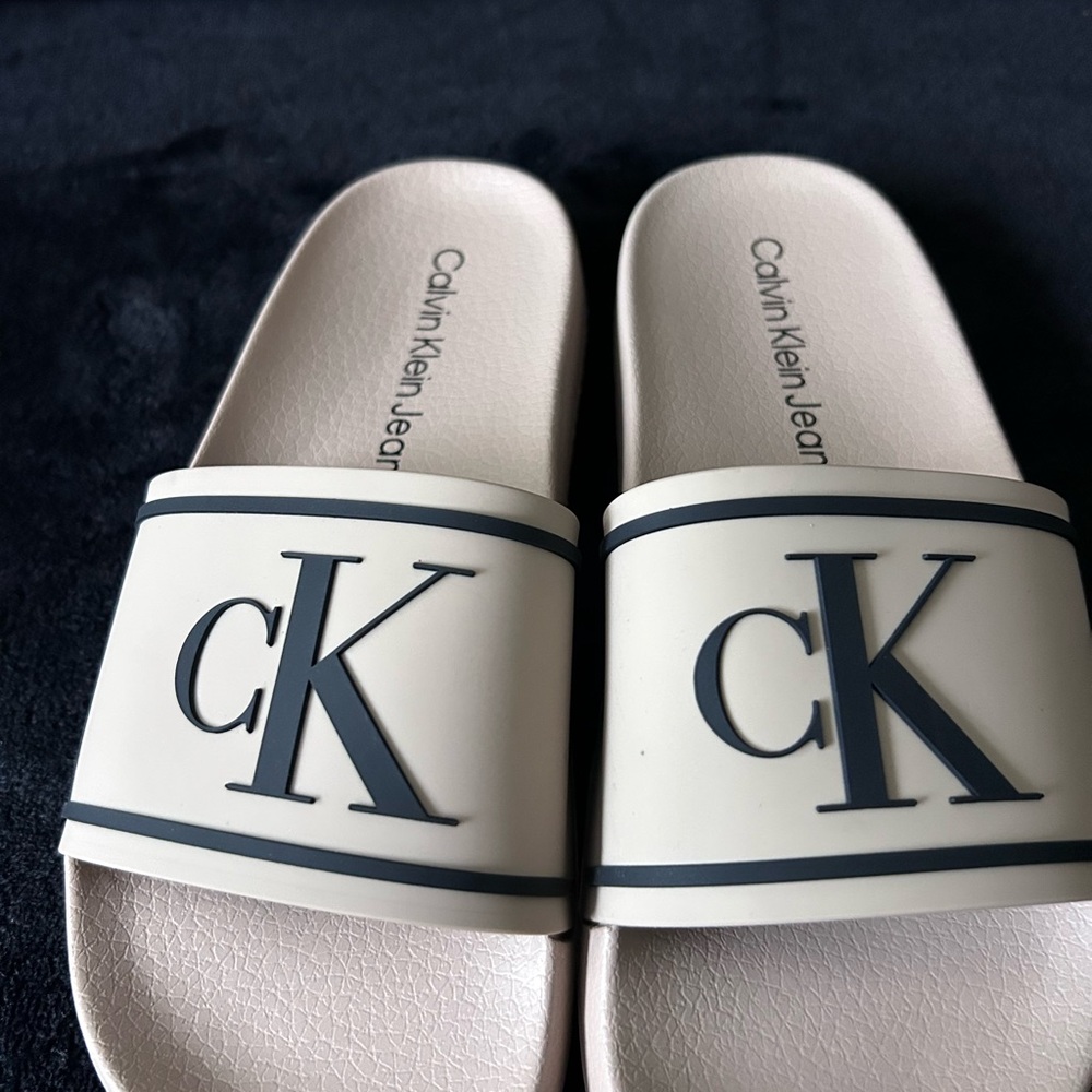 Calvin Klein Jeans Tan Slide Sandals with Black CK Logo